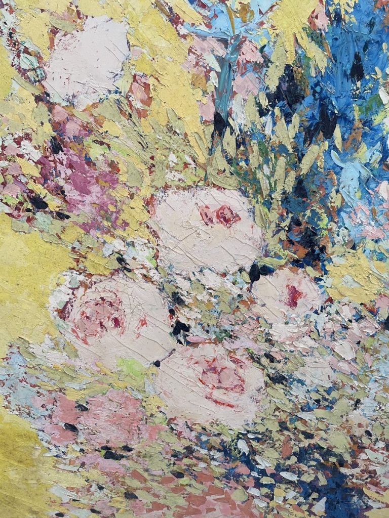 Close-up view of an abstract floral painting with vibrant colors and textured brush strokes.