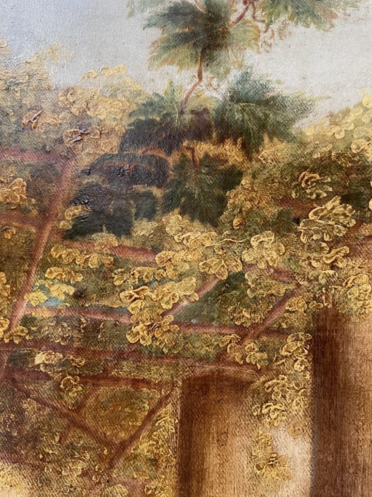 Close-up of an artwork displaying intricate golden floral designs and foliage.