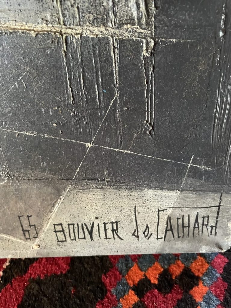 Signature of the artist S. Gouvier de Lachard on a textured surface.