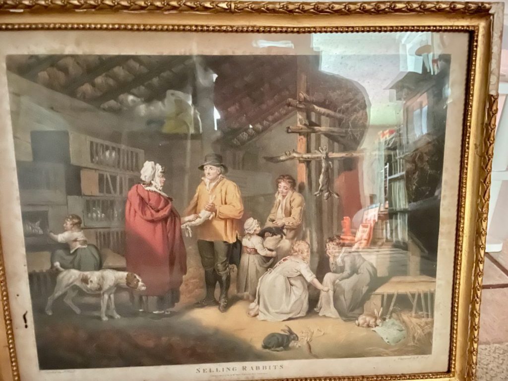 Artistic depiction of a market scene with people selling rabbits in a shop setting.