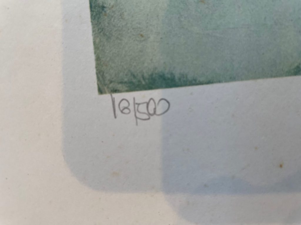 Close-up of a limited edition print showing the numbering 18/500 in pencil.