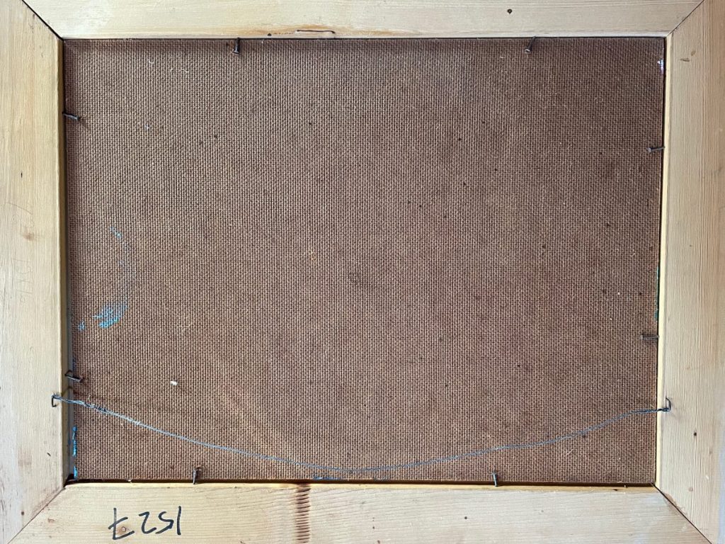 Back view of a wooden frame with a canvas and hanging wire attached.