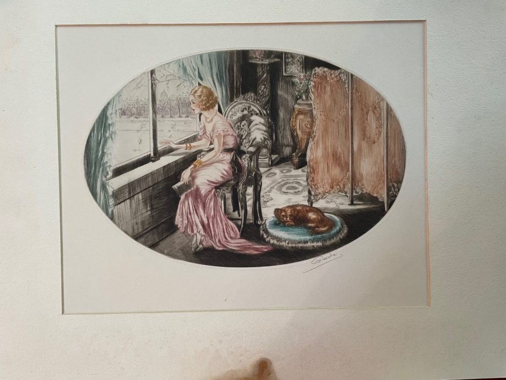 A woman in a pink dress seated by a window, gazing outside with a dog resting nearby.