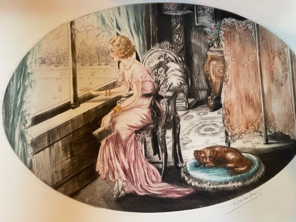 A woman in a pink dress sitting by a window, looking outside with a dog resting nearby on a cushion.