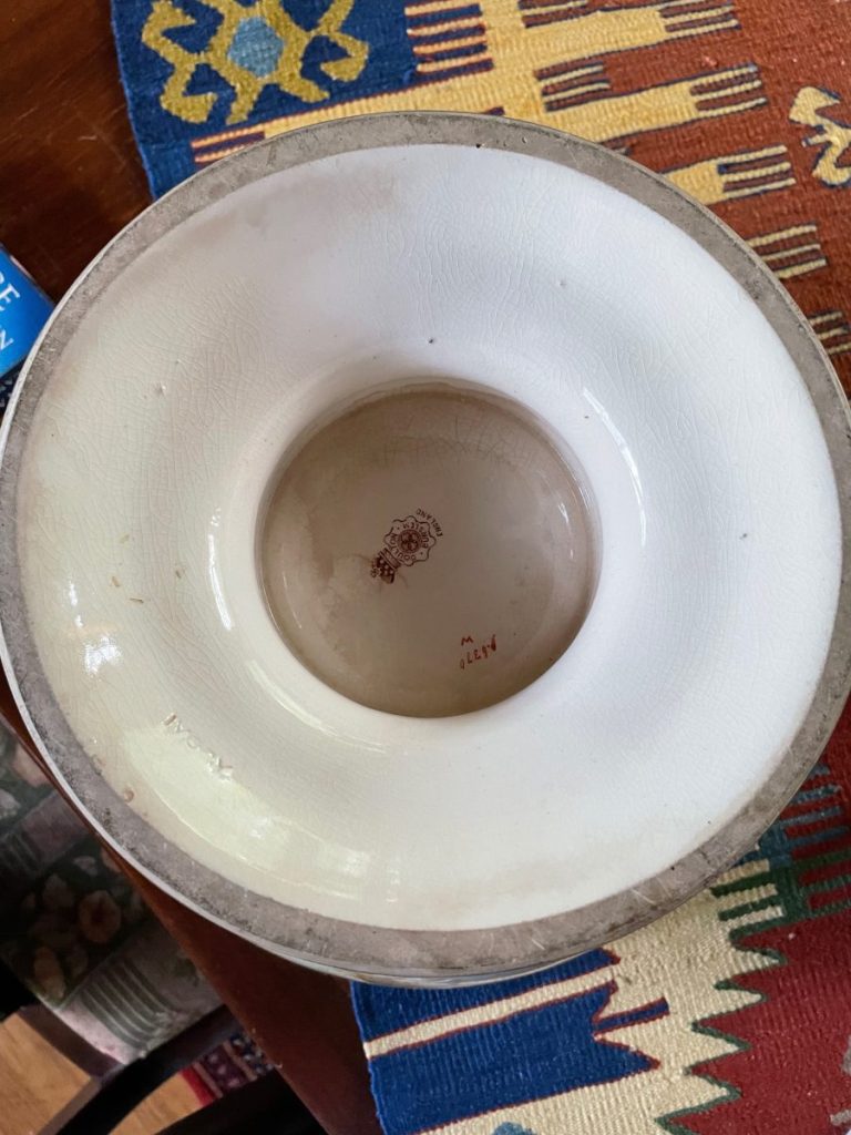Interior view of a ceramic bowl showing a smooth surface and decorative rim design.