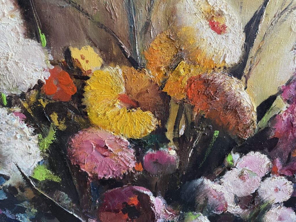 Close-up of an oil painting featuring a variety of colorful flowers in different shades.