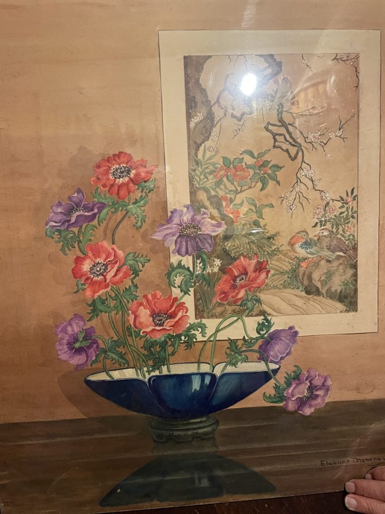 A floral painting featuring colorful anemones in a blue vase with a background scene of birds and trees.