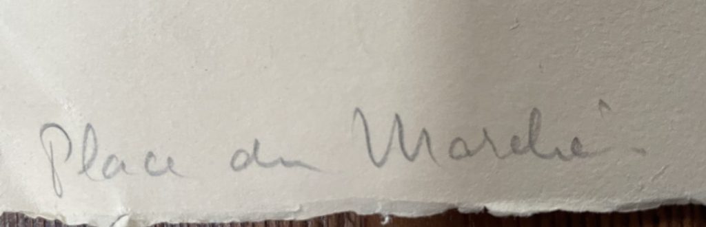 A handwritten note featuring the text 'Place du Marché' in cursive script.