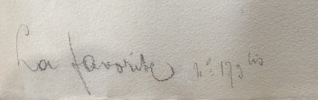 Handwritten signature on a piece of paper with the name 'La familia' and the year '1990'.