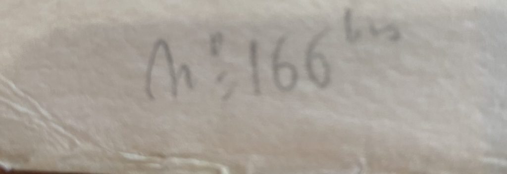 A close-up of a handwritten note showing the text 'An' followed by a number '166'.