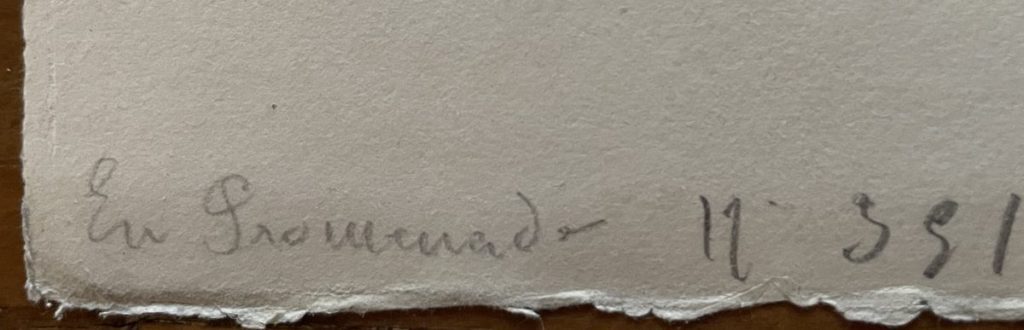 Close-up of a handwritten signature on a piece of paper with visible texture.
