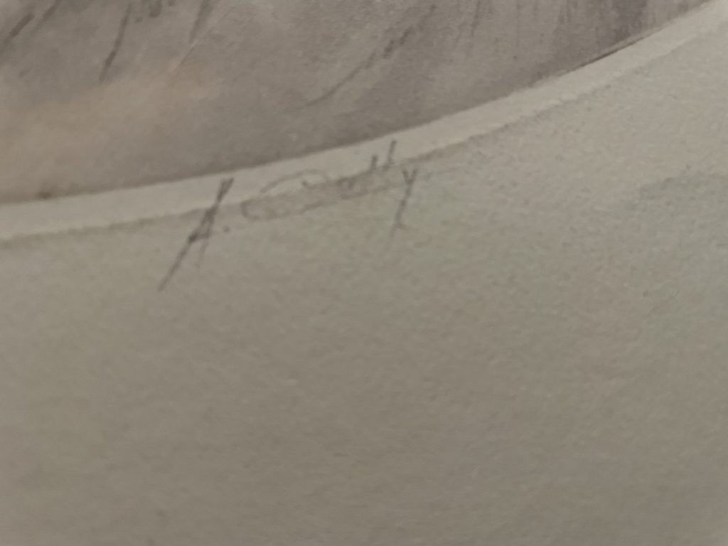 Close-up of the signature 'A. Caddy' on a piece of artwork.