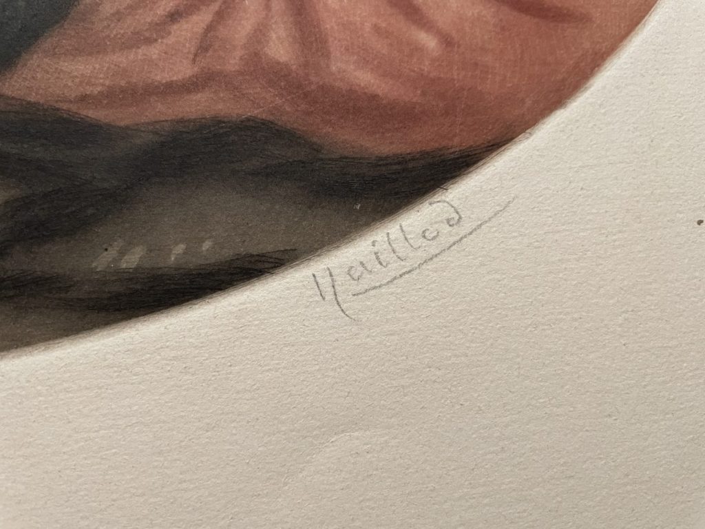 Close-up of a signature on a piece of artwork, written in pencil on the bottom right corner.