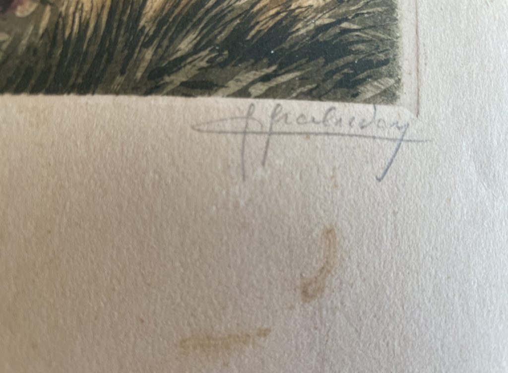 A close-up view of a signature on a piece of artwork, with visible paper texture and stains.